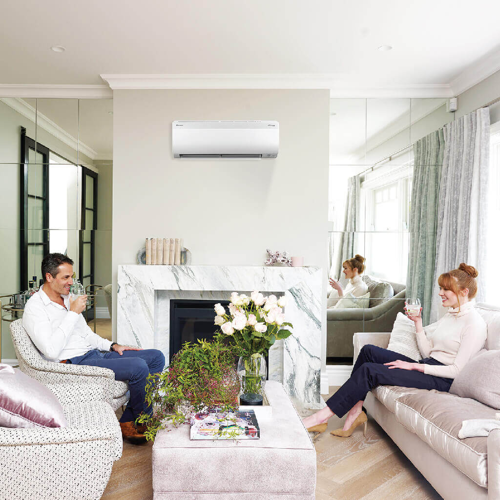 Couple enjoying Daikin Installation of reverse cycle split system Air Conditioning unit in Gold Coast.